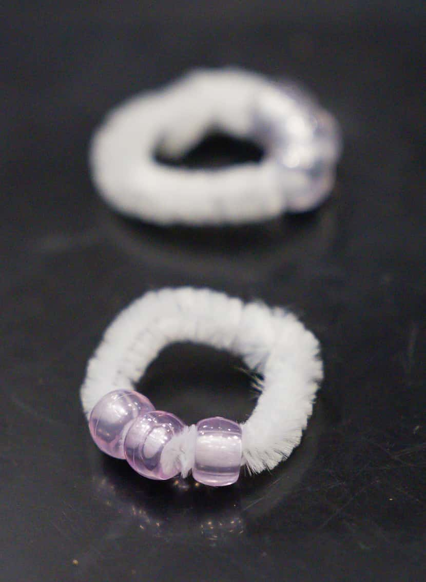 UV beads turn purple after exposure to UV light during a scientific process as part of GSK...